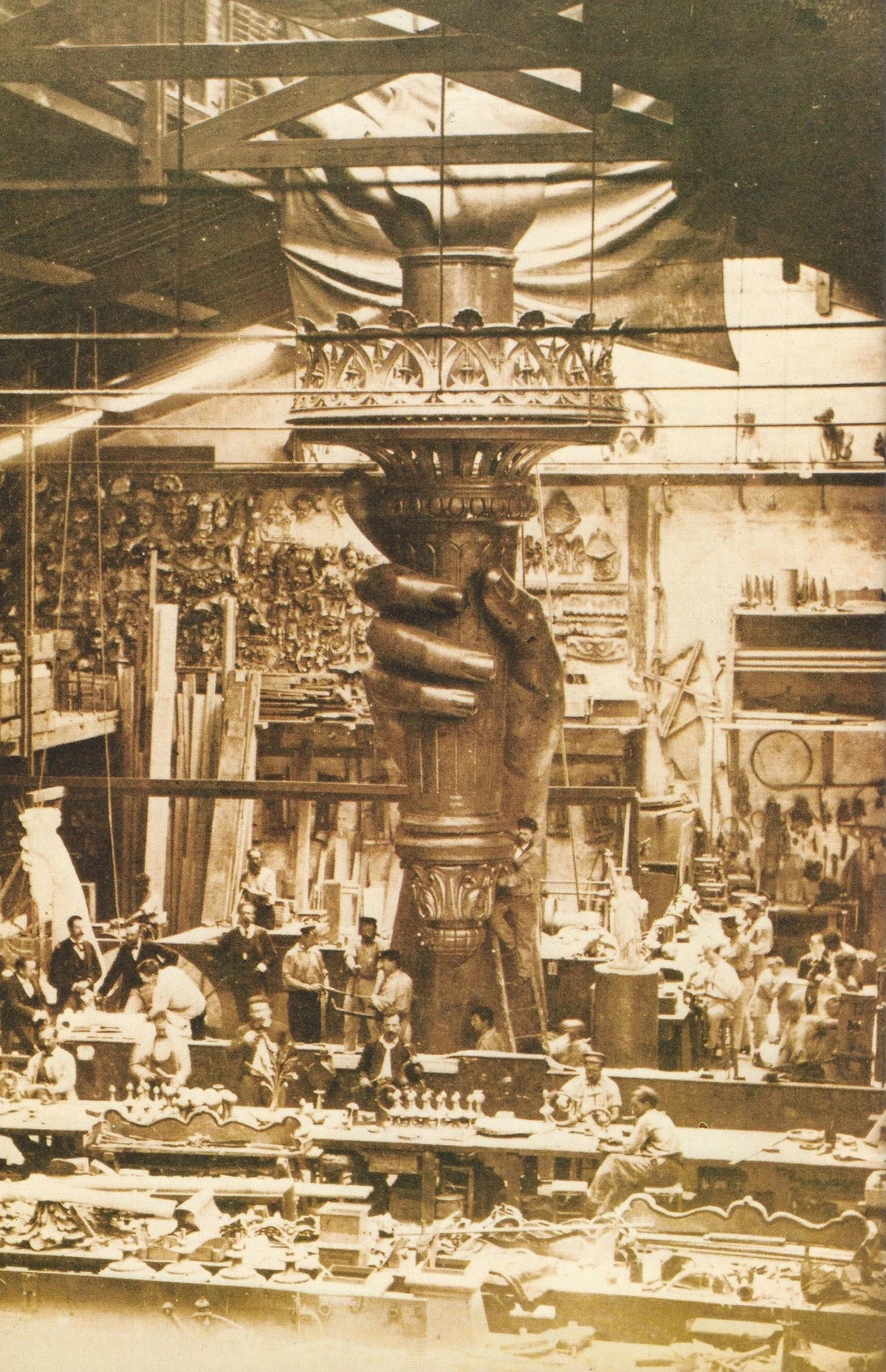 The Statue of Liberty under construction in the Paris workshop where its copper was hammered by hand.