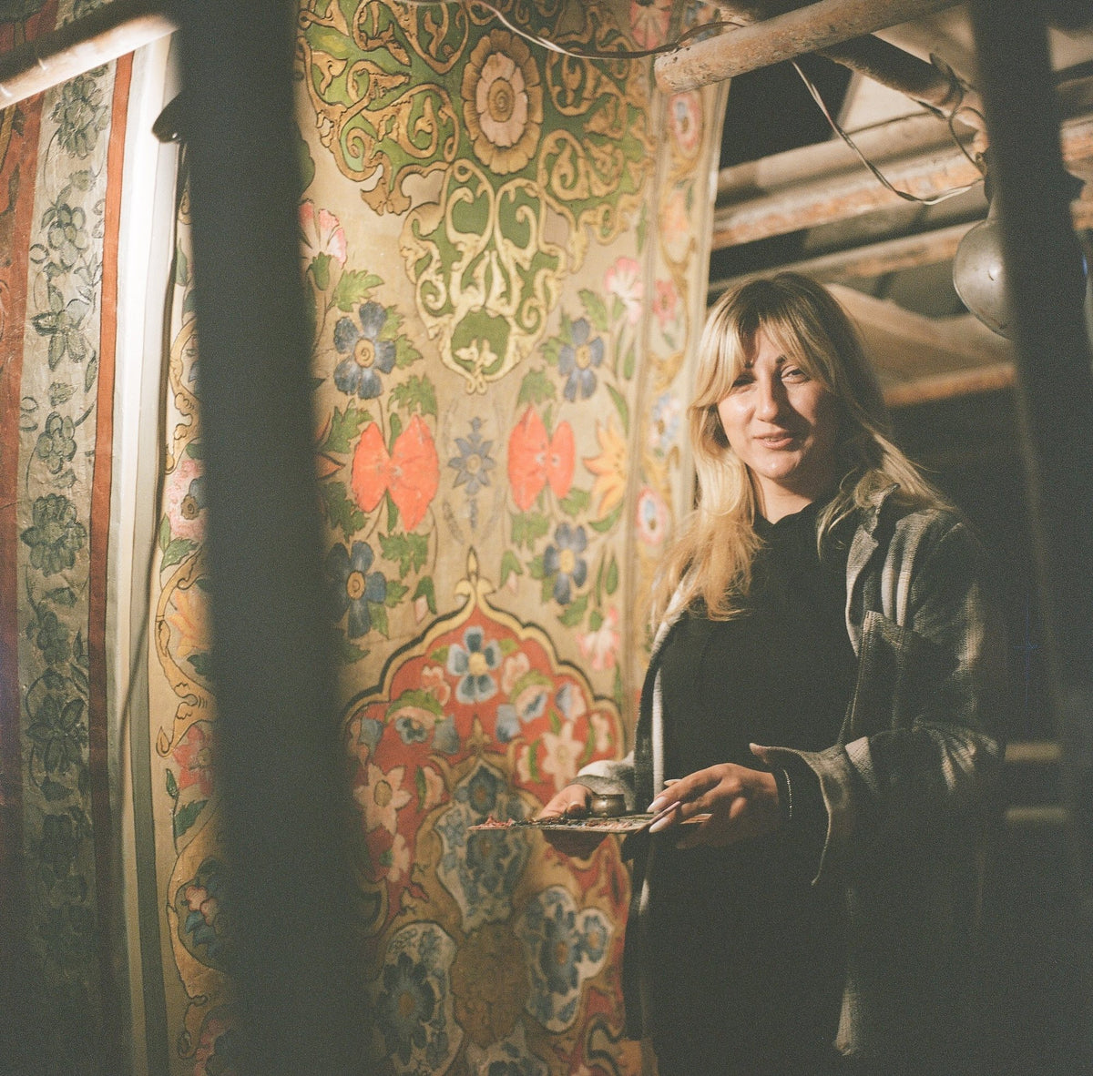 A painter at work on the floral murals of a church interior