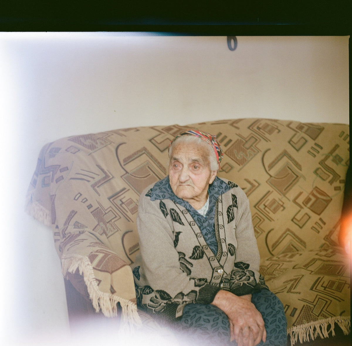Portrait of an elderly Armenian woman seated in her armchair